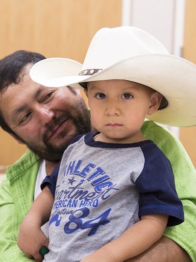 little boy in cowboy hat